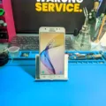 Samsung J7 Prime: Layar Bertompel Hitam & SIM Card Tidak Terbaca? Ini Solusinya!